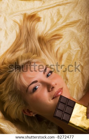 Beautiful girl with a chocolate craving close-up portrait