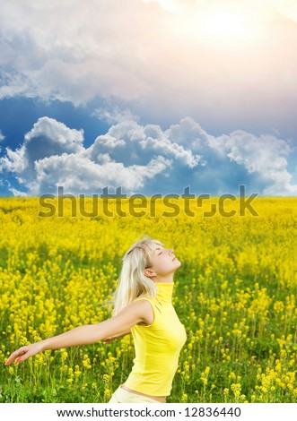 Happy young woman in a flower field