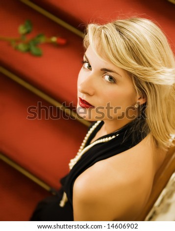 ]♥[ كوني مميزهـ وجذاابــهـ ]♥[  Stock-photo-beautiful-young-woman-standing-on-a-red-carpet-14606902