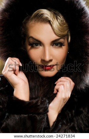 Beautiful woman in winter fur coat. Retro portrait