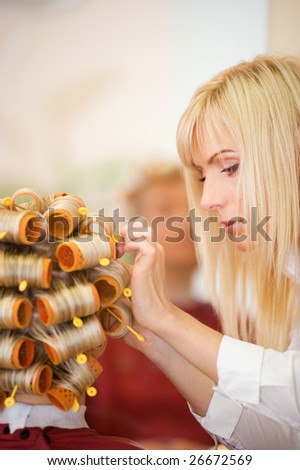Female hairdresser working in beauty salon