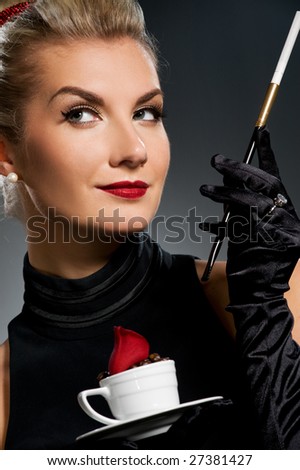 Charming lady with coffee cup and mouthpiece