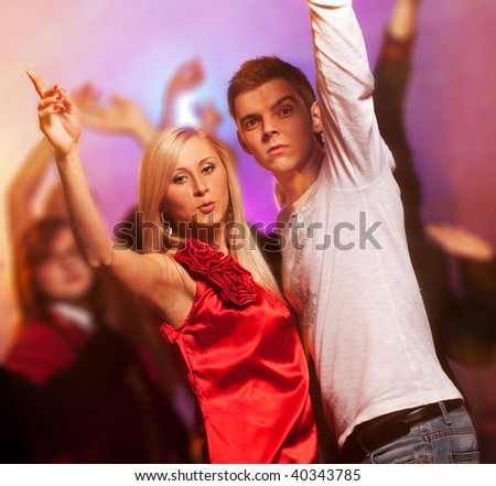Happy couple in the night club