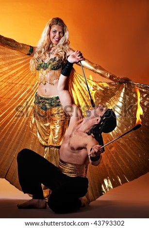Arabic dancer with fire eater