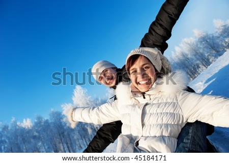 Happy smiling couple on a winter background