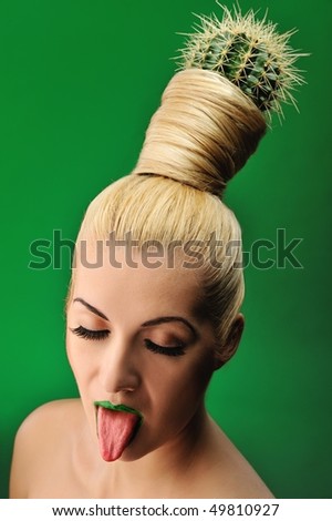 Woman with cactus in her hair - stock photo