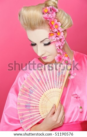Beautiful geisha with a fan