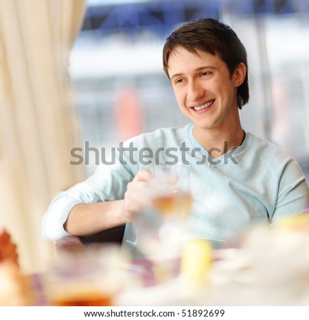 Happy man in a restaurant