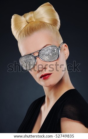 Close-up portrait of a beautiful woman in stylish glasses