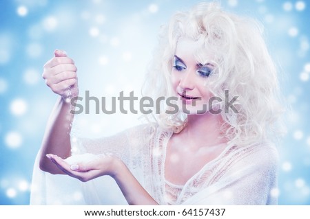 Snow queen playing with snow