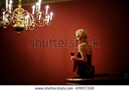 Attractive lady with a glass of red wine