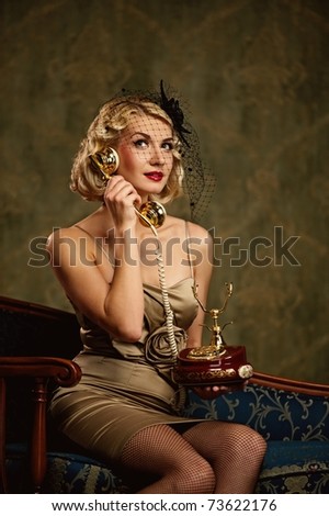 Lovely woman with a phone. Retro portrait
