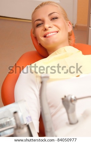 Happy patient at the dentist\'s surgery.