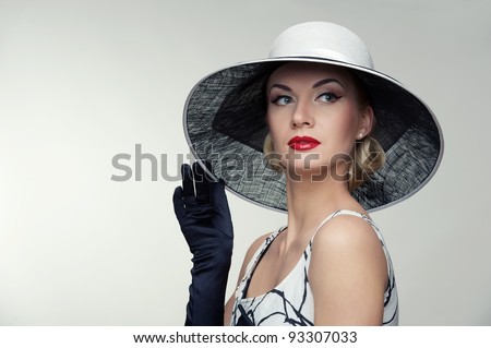Woman in hat retro portrait.