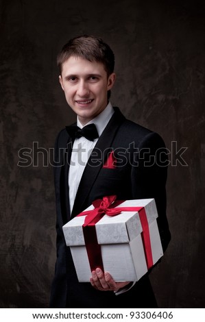 Young man with a gift box.