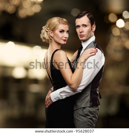 Retro couple over blurred background.