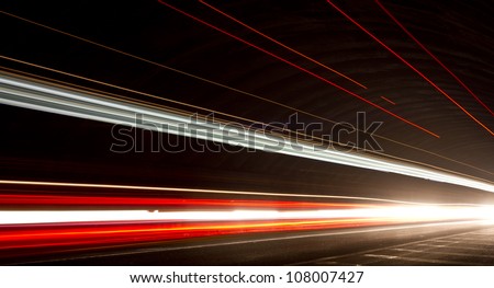 Truck light trails in tunnel. Art image . Long exposure photo taken in a tunnel.\
check my lightbox  http://www.shutterstock.com/lightboxes.mhtml?lightbox_id=12253330&from=lihp&pos=0