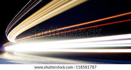 car light trails in tunnel. Art image . Long exposure photo taken in a tunnel