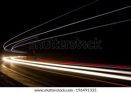 Truck light trails in tunnel. Art image . Long exposure photo taken in a tunnel