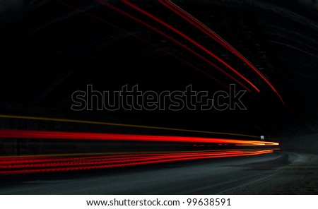 Truck light trails in  tunnel. Art image . Long exposure photo taken in a tunnel