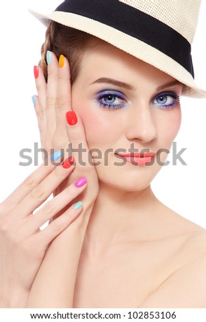 Portrait of young pretty smiling girl with bright make-up and colorful nail polish, on white background
