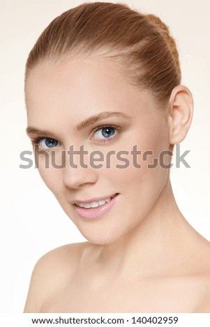 Portrait of young beautiful healthy happy smiling girl with clean make-up