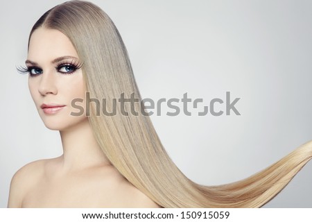 Young beautiful woman with long blond hair and stylish make-up