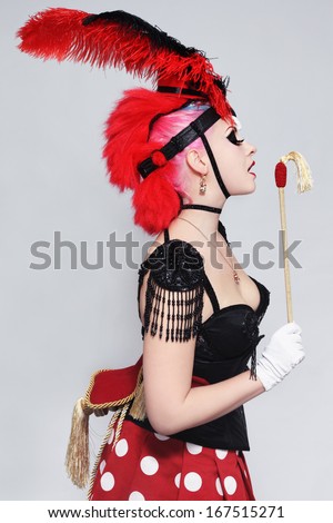 Pretty sexy burlesque girl in fancy costume of horse
