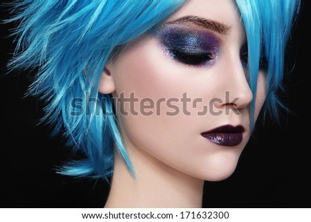 Close-Up Portrait Of Young Beautiful Woman In Blue Cosplay Wig
