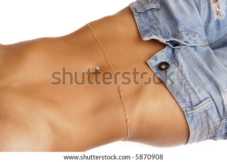 stock photo : Beautiful belly of tanned woman with piercing and golden chain 