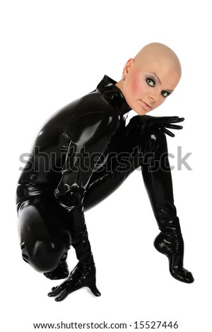 stock photo Skinhead slim woman in black latex catsuit sitting on white 