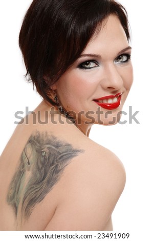 stock photo Attractive smiling woman with tattoo of wolf on her shoulder