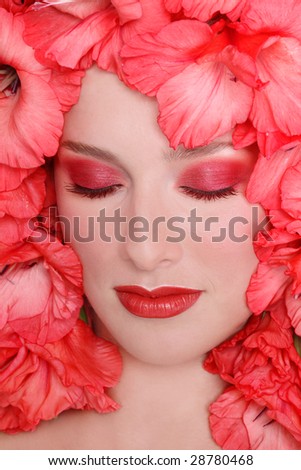 Portrait of beautiful girl with closed eyes and flowers around her face