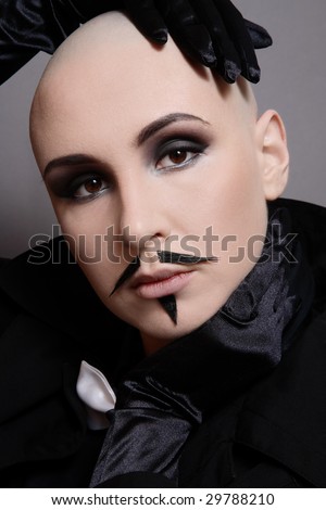 stock photo Portrait of skinhead girl in black clothes and false mustache 