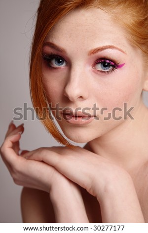 stock photo Portrait of young beautiful redhead girl with freckles