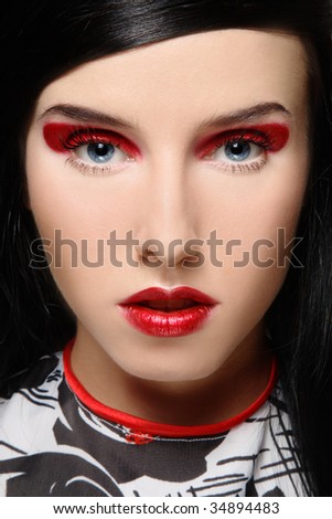 dark red hair makeup.  portrait of beautiful girl with dark hair and stylish red makeup