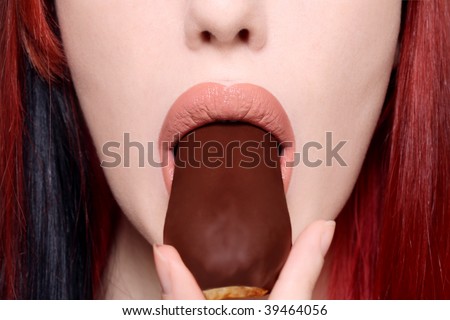 Close-up shot of beautiful woman mouth with chocolate cake, selective focus
