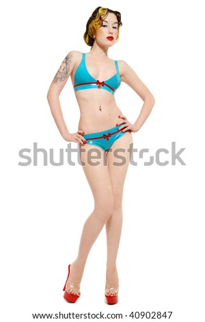 stock photo Slim girl in sexy latex bikini and stilettos over white 