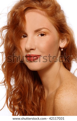 Portrait of beautiful young girl with red curly hair and freckles on her