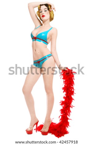 stock photo Slim girl in sexy latex bikini and stilettos with red boa in