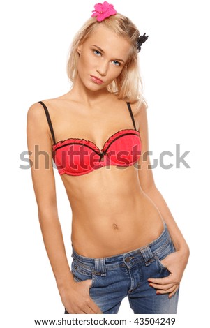 stock photo Beautiful slim sexy blonde girl in bra and jeans on white 