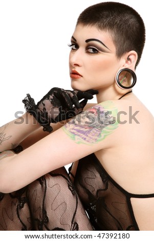 stock photo Sexy tattooed woman with short haircut and fancy makeup