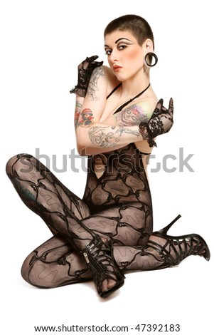 stock photo Beautiful young sexy tattooed woman in lacy bodystockings 