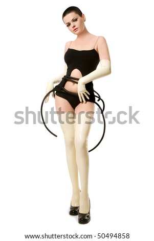 Slim woman with short haircut in fancy futuristic clothes, latex gloves and stockings over white background