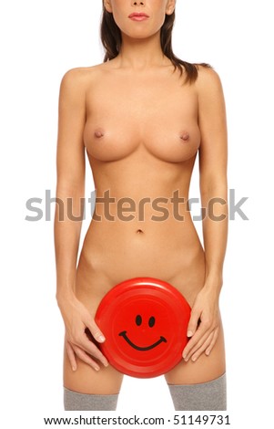 stock photo Torso of slim tanned sexy naked woman with red frisbee in 