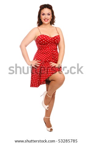Attractive happy smiling plus-size woman in vintage dress and stockings over white background