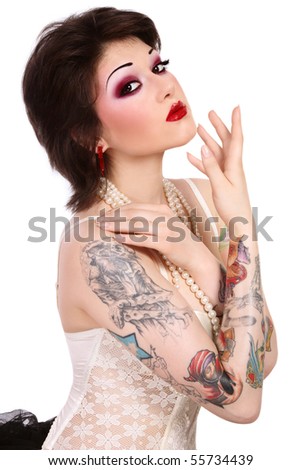 stock photo Beautiful slim young tattooed woman in ballet skirt and 