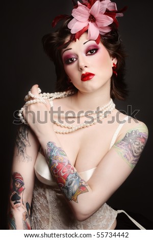 stock photo : Beautiful slim young tattooed woman in ballet skirt and