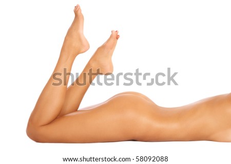 stock photo Torso bum and legs of slim tanned sexy naked woman lying on