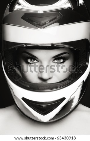 Duotone portrait of beautiful woman in biker helmet
